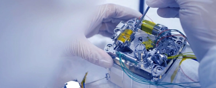 engineer-assembling-small-satellite-propulsion-system