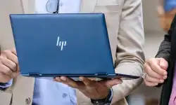 holding-laptop